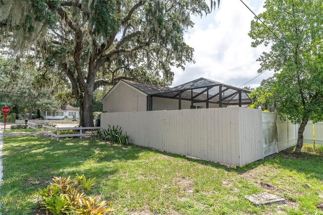 view of yard with a lanai