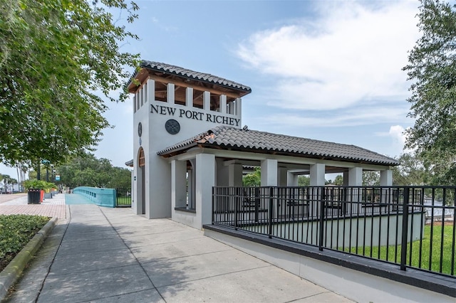 view of gate featuring a gazebo and a swimming pool