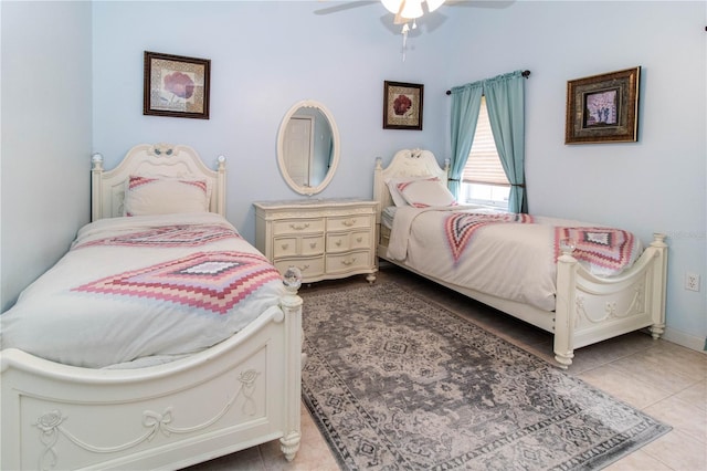 bedroom with tile patterned floors and ceiling fan