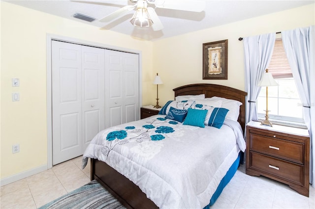 tiled bedroom with a closet and ceiling fan