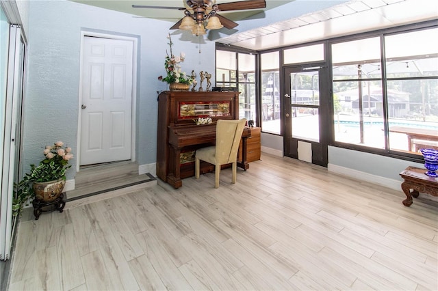 office area featuring ceiling fan and light hardwood / wood-style floors