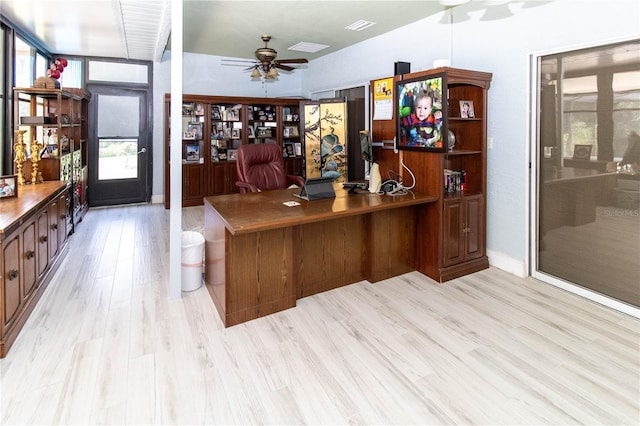 office with ceiling fan and light hardwood / wood-style flooring