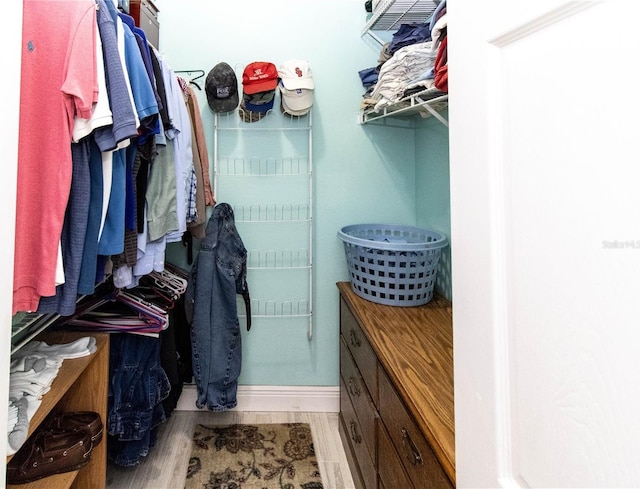 spacious closet featuring light wood-type flooring