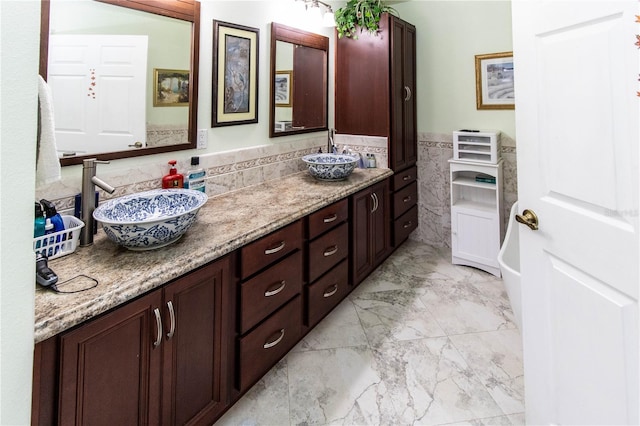 bathroom featuring double sink vanity and tile patterned floors