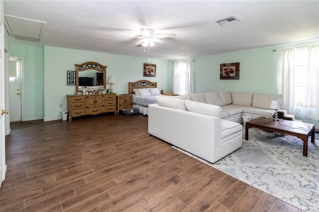 living room featuring ceiling fan and wood-type flooring