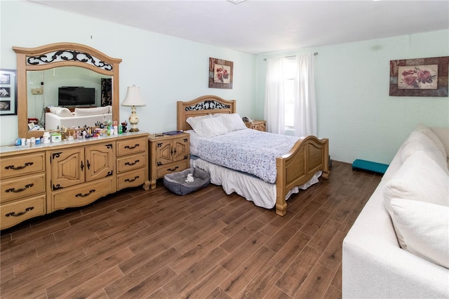 bedroom featuring dark hardwood / wood-style flooring