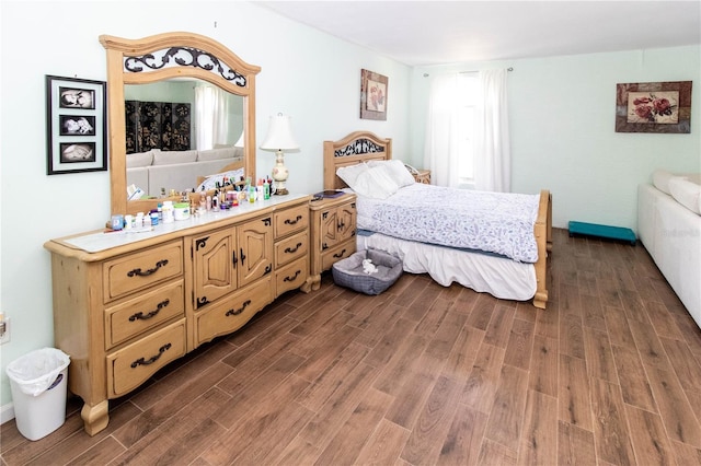 bedroom featuring dark hardwood / wood-style flooring