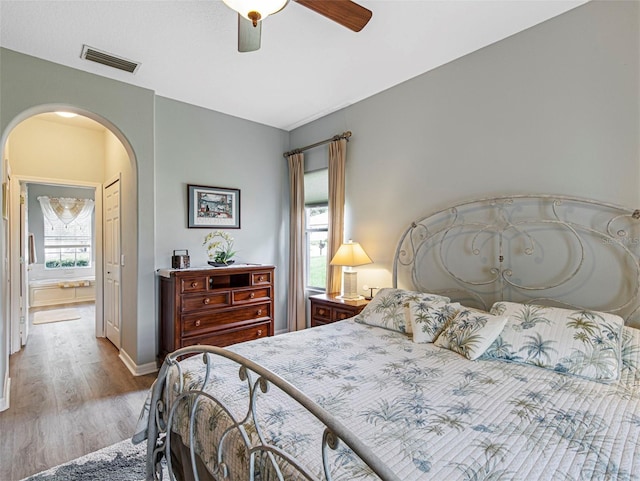 bedroom with light hardwood / wood-style floors and ceiling fan