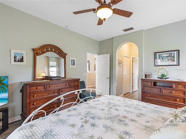 bedroom featuring dark hardwood / wood-style flooring and ceiling fan