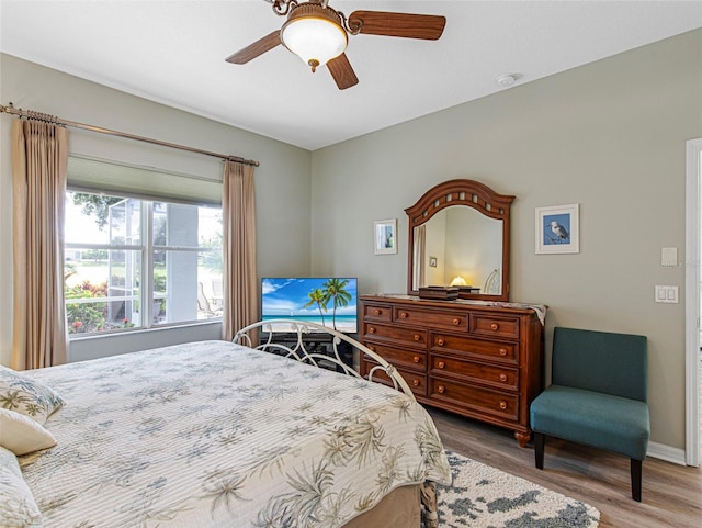 bedroom featuring ceiling fan and hardwood / wood-style flooring