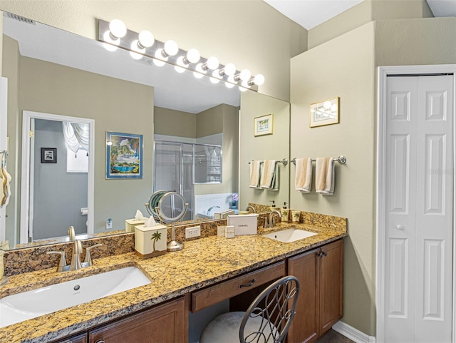 bathroom featuring walk in shower and vanity