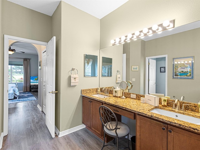 bathroom with vanity, ceiling fan, and hardwood / wood-style floors