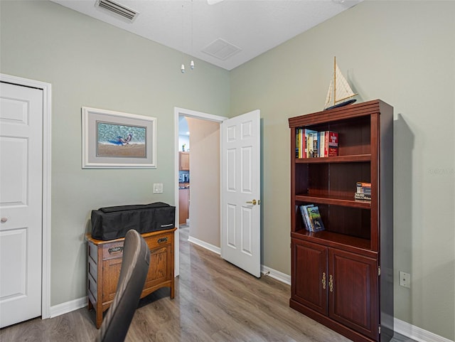 living area with light hardwood / wood-style flooring