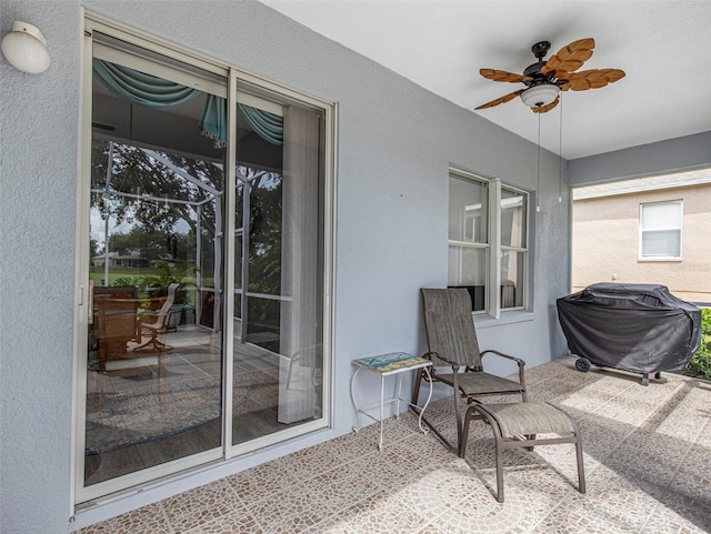 view of patio / terrace featuring area for grilling and ceiling fan