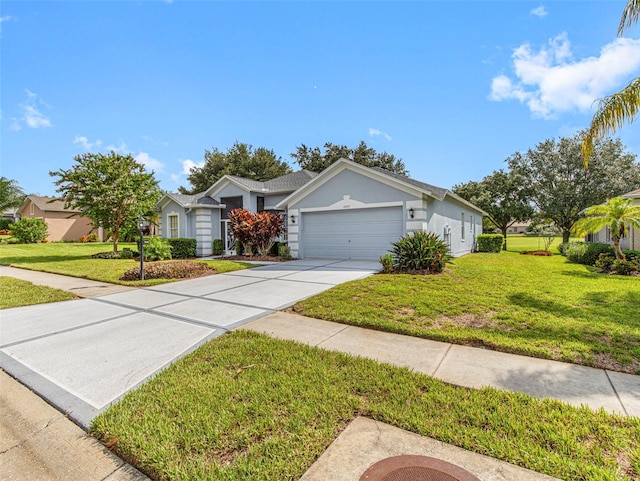 ranch-style house with a garage and a front lawn