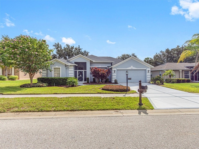 single story home featuring a garage and a front yard