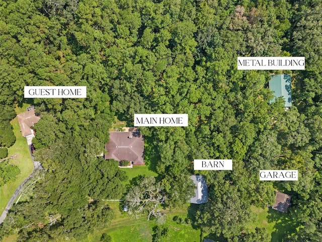 aerial view featuring a wooded view