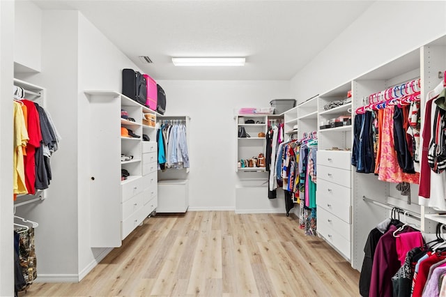 spacious closet with visible vents and light wood-style flooring