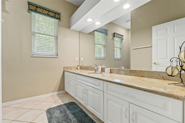 bathroom featuring baseboards, recessed lighting, vanity, and tile patterned floors