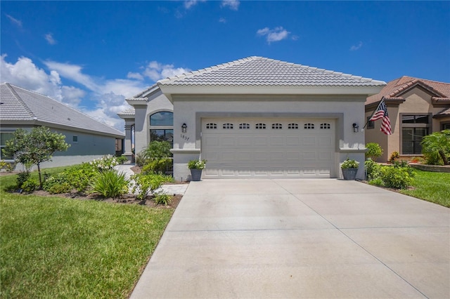 view of front facade with a garage and a front lawn