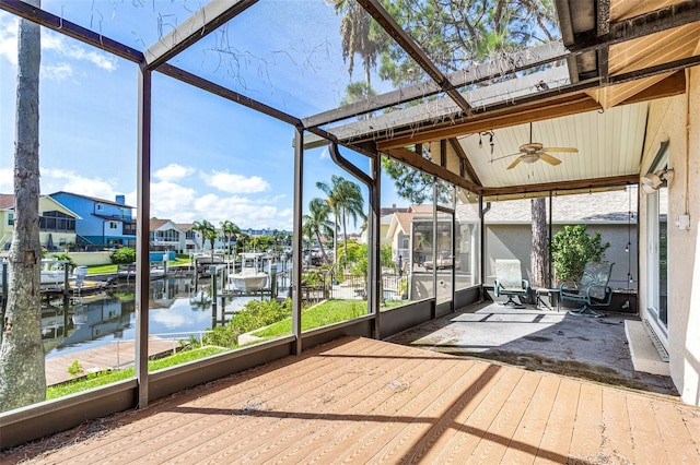 6316 Spoonbill Dr, New Port Richey, FL 34652 - unfurnished sunroom with plenty of natural light, a water view, and a ceiling fan