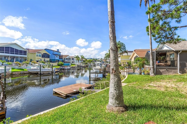 6316 Spoonbill Dr, New Port Richey, FL 34652 - view of dock with a yard, a water view, and a residential view