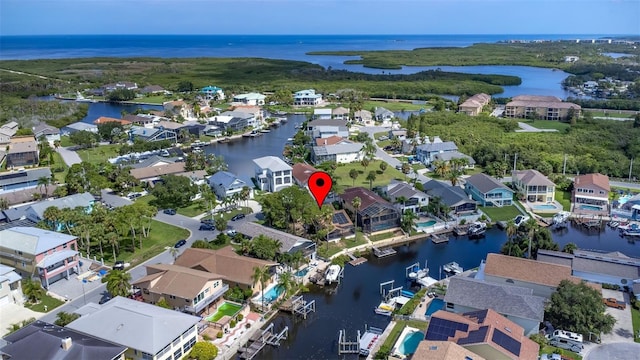 birds eye view of property with a water view