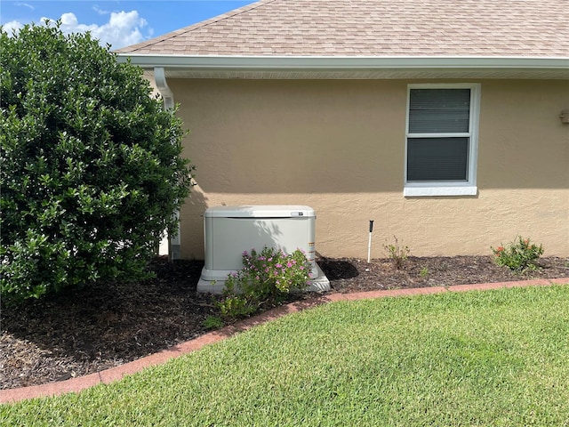 view of side of property with a yard