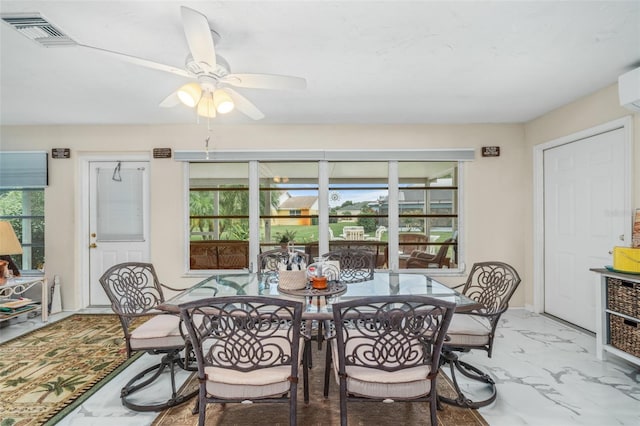 dining area with ceiling fan