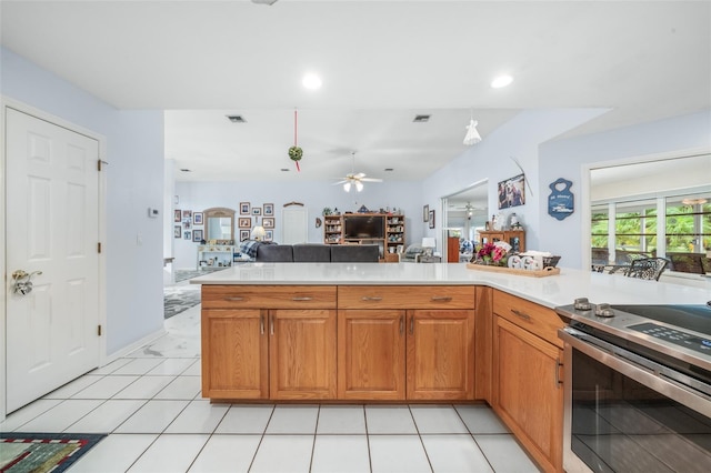 kitchen with stainless steel electric range, ceiling fan, and light tile patterned floors