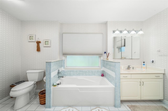 bathroom featuring toilet, vanity, tile patterned flooring, and a bathing tub