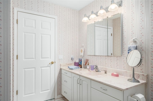 bathroom featuring tile patterned flooring and vanity