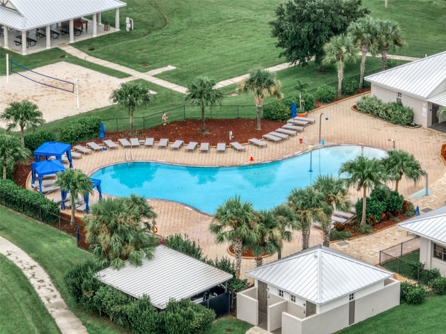 view of swimming pool featuring a yard and a patio area