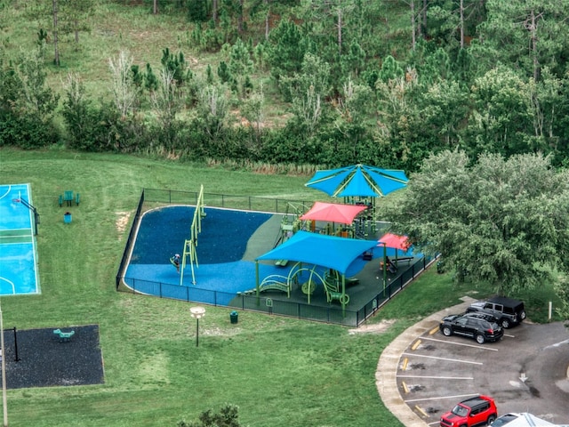 view of swimming pool with a lawn