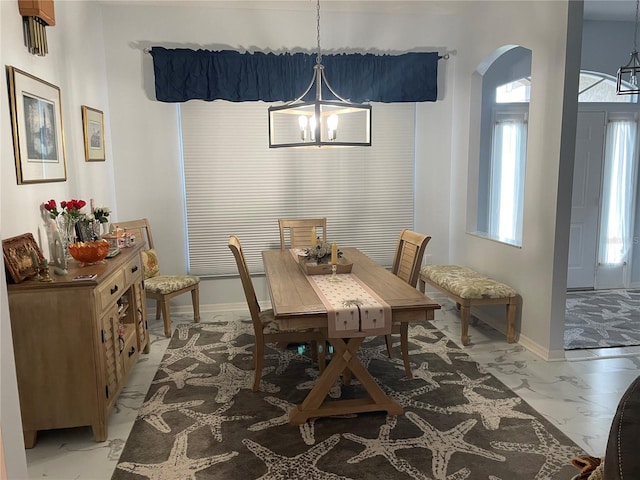 dining room featuring a chandelier