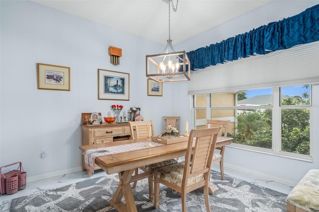 dining space with a notable chandelier