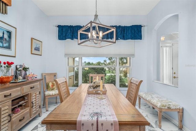 dining space featuring a chandelier