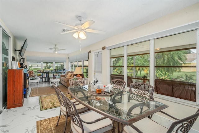 dining room featuring ceiling fan