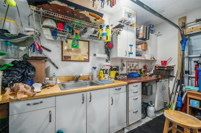 kitchen with white cabinetry and sink