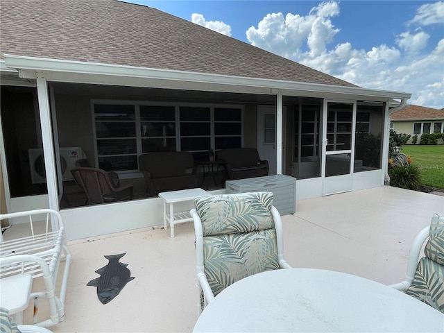 view of patio / terrace with a sunroom