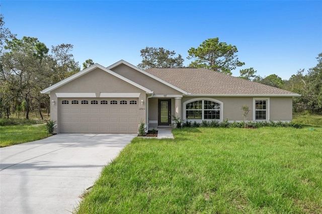 ranch-style home featuring a front yard and a garage