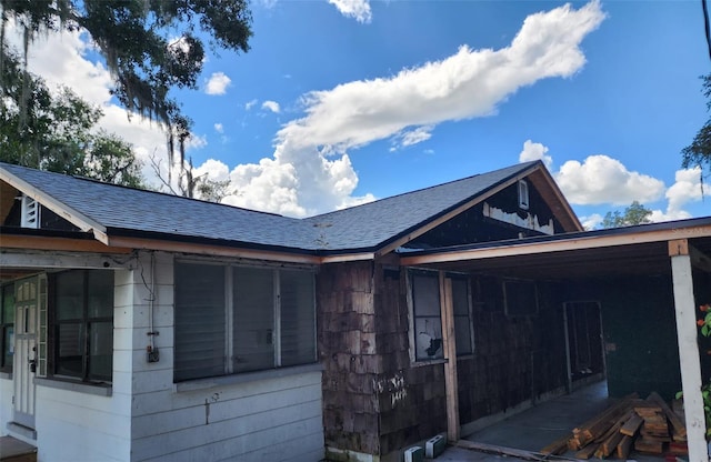 view of side of property featuring a carport