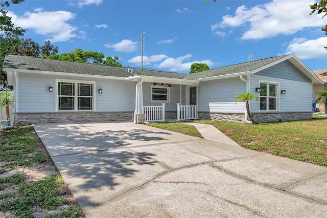 single story home with a porch and a front yard