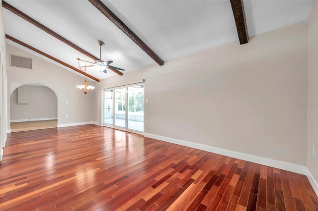 spare room featuring baseboards, visible vents, wood finished floors, vaulted ceiling with beams, and ceiling fan with notable chandelier