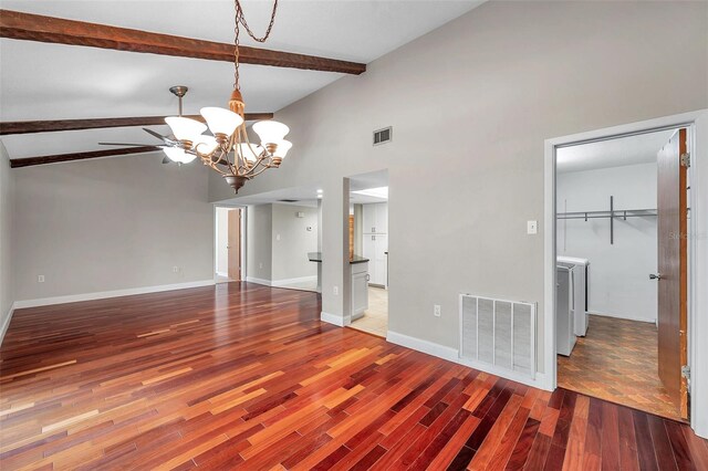 spare room with beam ceiling, a notable chandelier, tile patterned flooring, and high vaulted ceiling