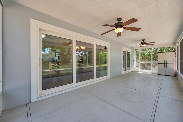 exterior space with ceiling fan