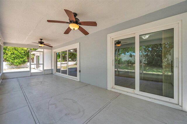 view of patio featuring french doors and ceiling fan