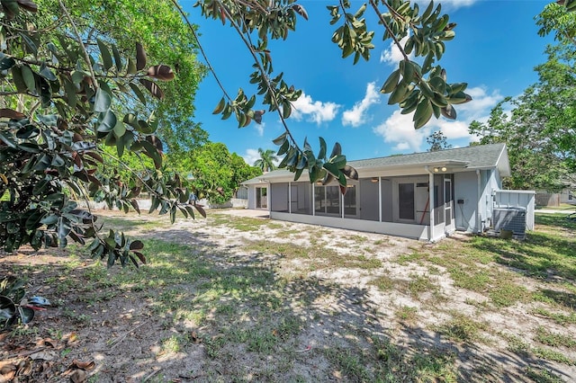 back of property featuring a sunroom