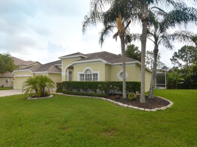 view of front of house featuring a front lawn and a garage