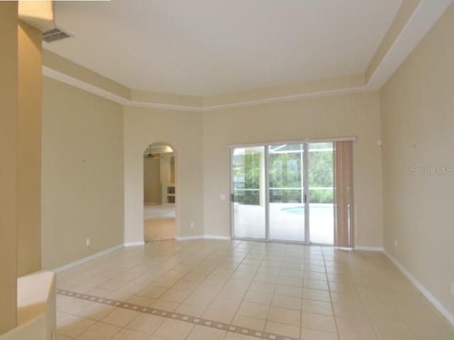 unfurnished room featuring light tile patterned floors